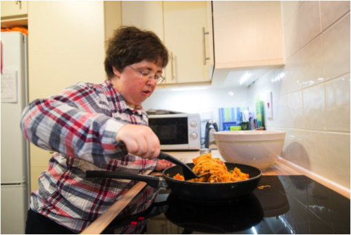 Woman cooking in the kitchen | Harpenden Mencap