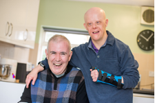 Two People Smiling at The Camera | Harpenden Mencap