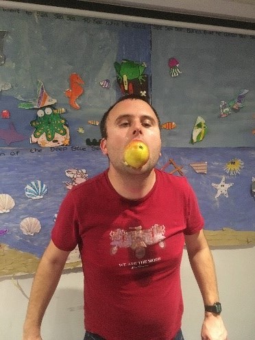 Man eating an apple | Harpenden Mencap