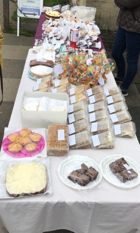 Cakes and biscuits on a stall | Harpenden Mencap