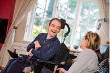 Two People Talking and Smiling | Harpenden Mencap